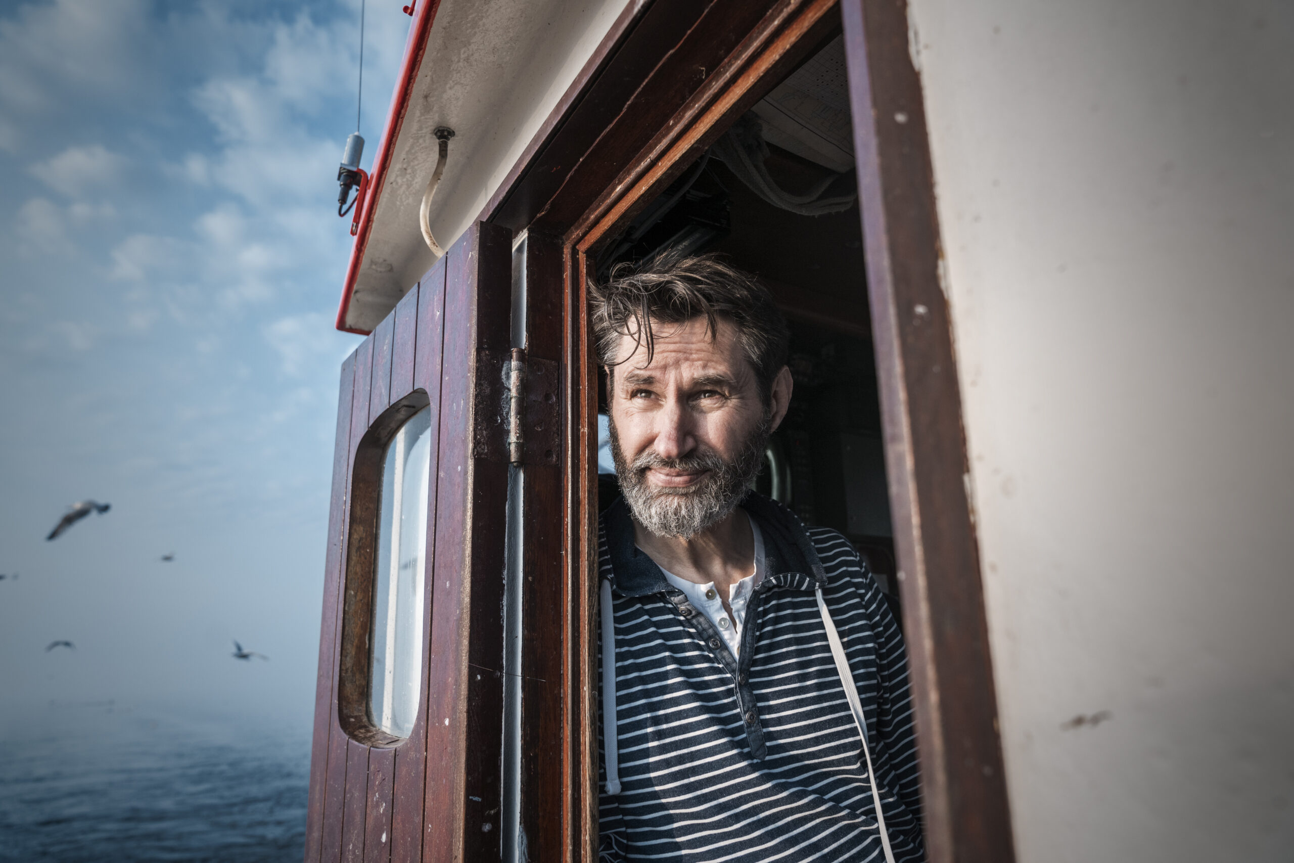 two oilmaxx oil tankers with the logo on the side of the tanker in a yard
